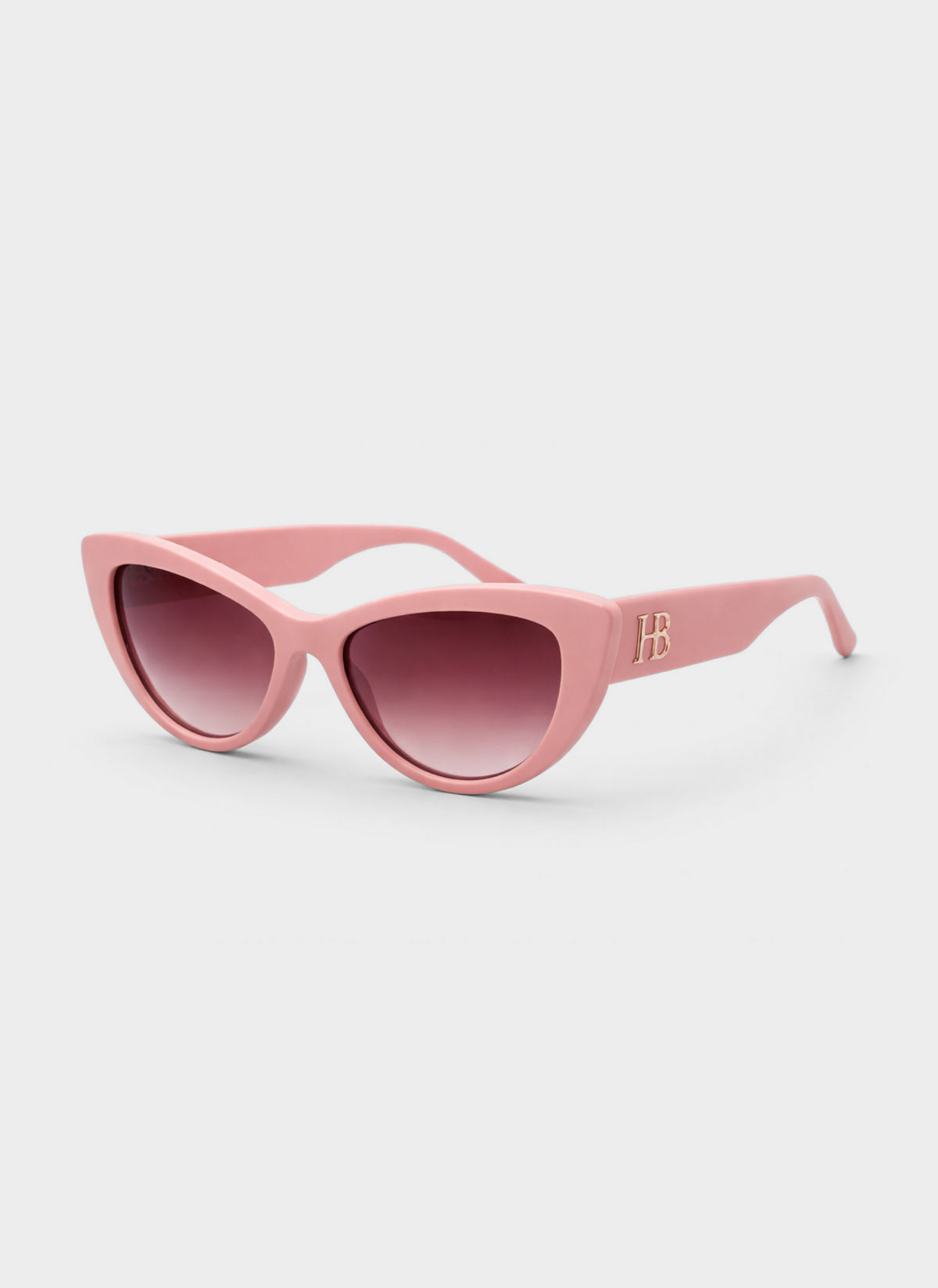 Pink sunglasses with a brand logo on a light gray background