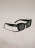 Black cat-eye sunglasses with dark lenses, featuring a gold &