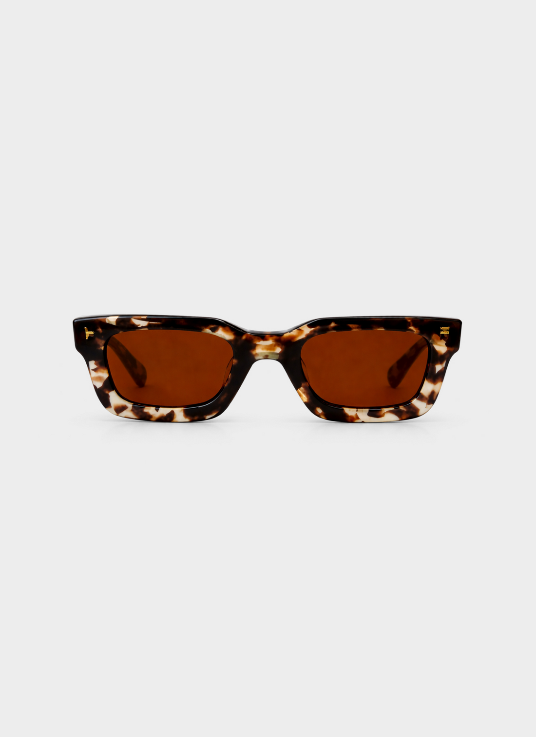 Tortoiseshell sunglasses with brown lenses on a white background