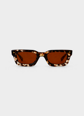 Tortoiseshell sunglasses with brown lenses on a white background