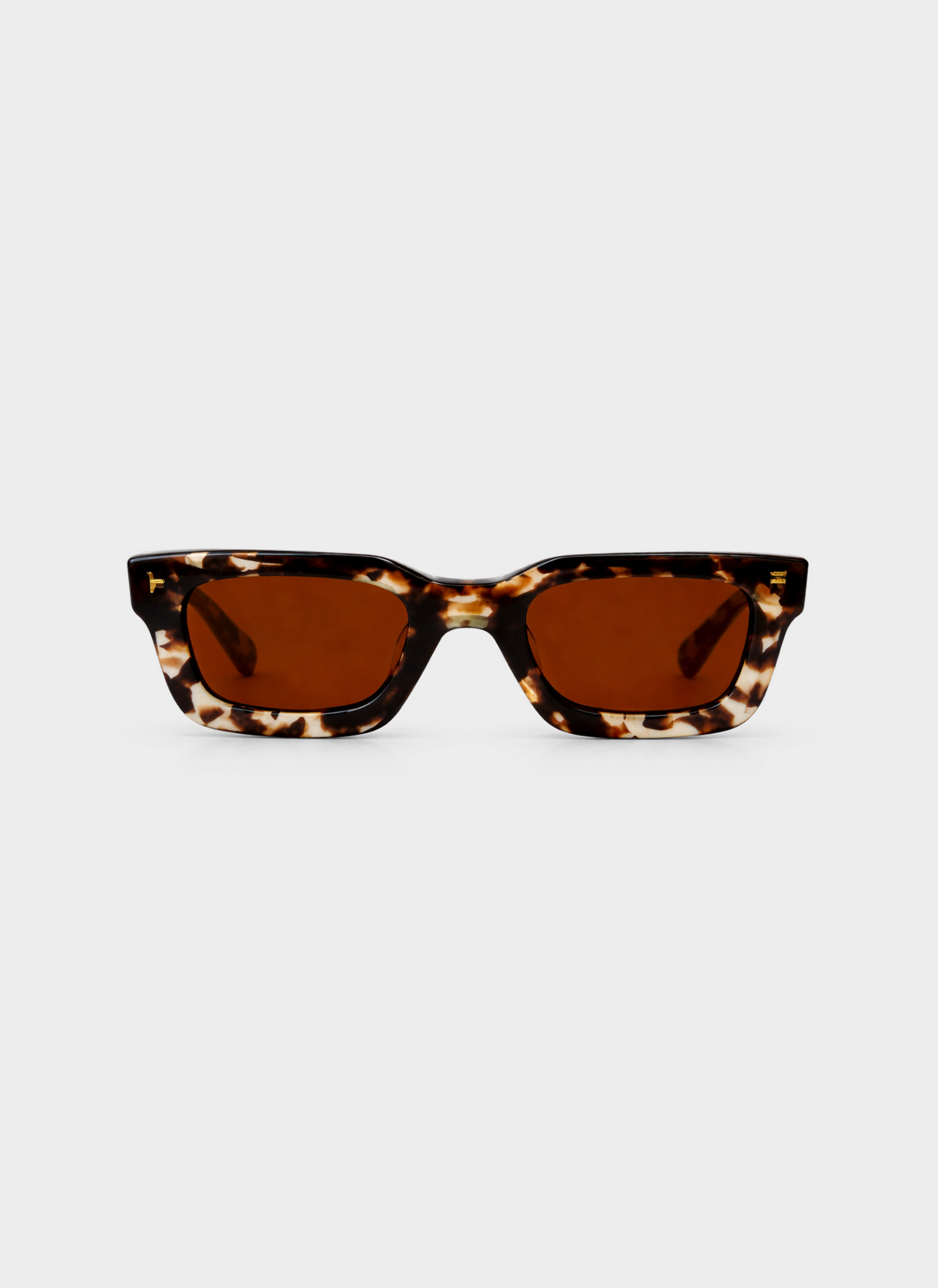Tortoiseshell sunglasses with brown lenses on a white background